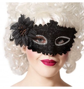 Máscara veneziana preta com flor para completar o seu disfarce